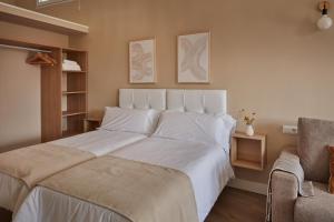 מיטה או מיטות בחדר ב-Apartamentos Cuerda Larga