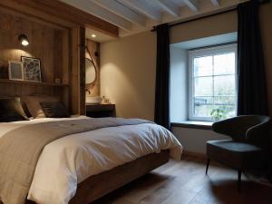 Postel nebo postele na pokoji v ubytování B&B En face du Marronnier