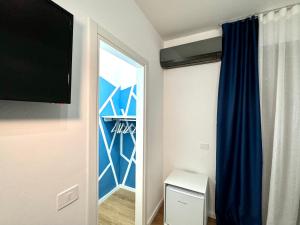 a room with a closet with a blue curtain at Annabella Bed and Breakfast in Giffoni Valle Piana