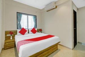 Katil atau katil-katil dalam bilik di OYO Hotel Shivay Executive Lodging & Boarding