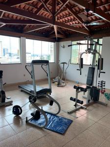 a gym with several exercise equipment in a room at Gran Lord Hotel in Pará de Minas