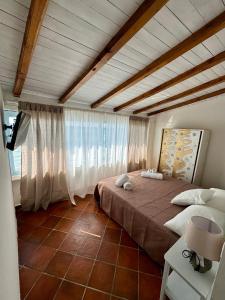 a bedroom with a large bed in a room at Golden Home in Anzio