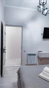 a bedroom with a large window and a bed at Mountain View Two in Tashkent +32 photos