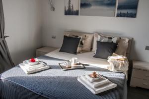 Postel nebo postele na pokoji v ubytování Monte Moro Gavi B&B
