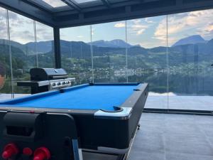 a pool table in a room with a view at Trolltun, Frystevegen 4 in Ulvik