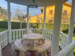 a table on the porch of a house at Casa Begoña - 7803 in Castillo