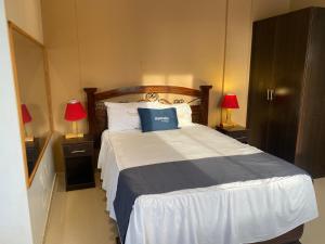 Uma cama ou camas num quarto em Suite Apart Miraflores