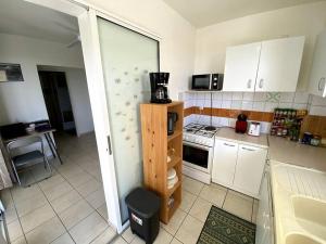 Η κουζίνα ή μικρή κουζίνα στο Appartement - Vue mer et montagne