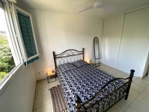 Ένα ή περισσότερα κρεβάτια σε δωμάτιο στο Appartement - Vue mer et montagne