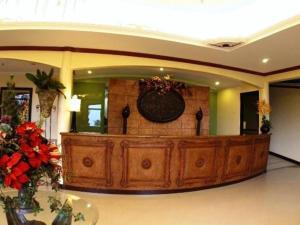 a large room with a large wooden desk in a building at Camiguin Highland Resort in Mambajao