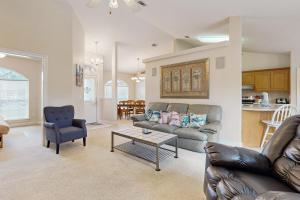a living room with a couch and a table at East Bay Getaway in Navarre
