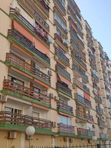 a tall building with balconies on the side of it at Ole Tû - Vacaciones 2 in Benalmádena