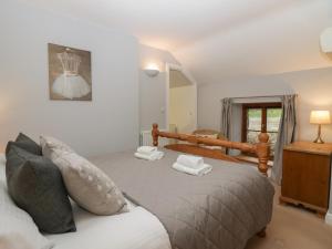 Ένα ή περισσότερα κρεβάτια σε δωμάτιο στο Winder Barn