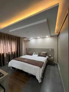 Krevet ili kreveti u jedinici u okviru objekta Nayru Hotel