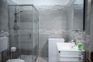 a bathroom with a shower and a toilet and a sink at Dimora Antonia in Lecce +20 photos