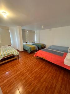 Postel nebo postele na pokoji v ubytování YOLO House Peru