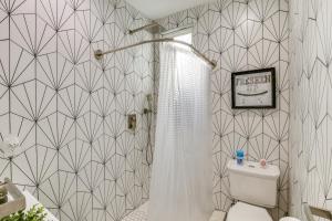 a bathroom with a shower and a toilet in it at East Los Angeles Studio - Near Dodger Stadium! in East Los Angeles