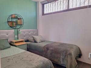 Postel nebo postele na pokoji v ubytování Stylish 2-Bedroom Apartment Yumbo