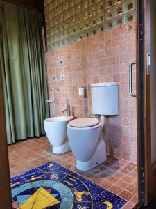 a bathroom with a toilet and a bidet at Lo Chalet d'Argento in Porto Ercole