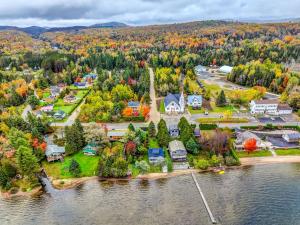 an aerial view of a small town on an island in the water at Your Cozy Cabin Retreat in Saint-Rémi-dʼAmherst