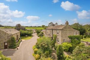 an aerial view of an old stone house at Cold Cotes Harrogate in Harrogate