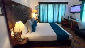 Voodi või voodid majutusasutuse Gomang Boutique Hotel toas