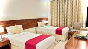 Säng eller sängar i ett rum på Rafahya Hotel Makkah فندق رفاهية مكة