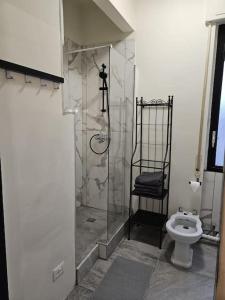 a bathroom with a shower and a toilet at Genova in Genoa