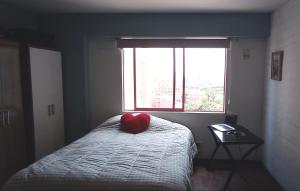 En eller flere senge i et værelse på Cozy Room - Margot Arimborgo