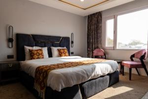 a bedroom with a large bed and a window at Bali guest house in Srinagar