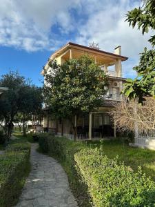 a house with a walkway in front of it at VİLLA KEYF in Side