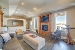 a living room with a couch and a fireplace at Welcoming Rigby Home with Game Room and Fire Pit! in Rigby