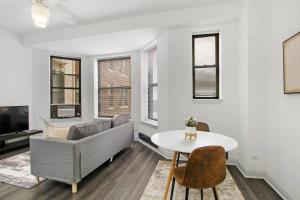 a living room with a couch and a table at 1BR Modern Apartment in Chicago - Del Prado 811 in Chicago