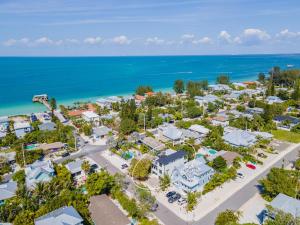 an aerial view of a resort with the ocean at Luxe Island Escape in Anna Maria