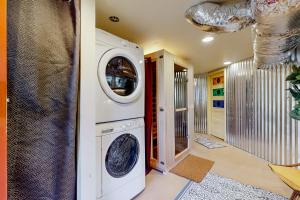 a laundry room with a washer and dryer at Zen Studio in Asheville