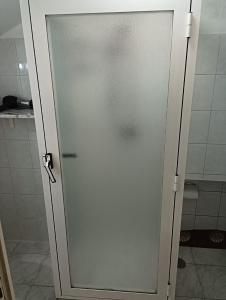 a glass shower door in a bathroom at CASA GENTILE in Giovinazzo