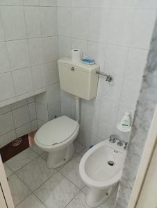 a small bathroom with a toilet and a sink at CASA GENTILE in Giovinazzo