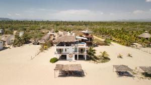 an aerial view of a house on the beach at Hotel Sanmara in La Sabrosa