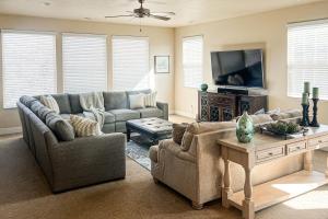 a living room with a couch and a tv at Sunset: Paradise Village #50 in Santa Clara