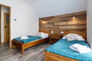 Posteľ alebo postele v izbe v ubytovaní ARAMIKA apartamenty