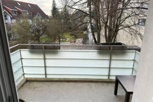 a white fence with a view of a fountain at Private Apartment in Hannover