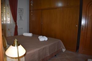 a bedroom with a bed with towels on it at Casa Milady in Sozopolis, Halkidiki in Sozopoli +88 photos