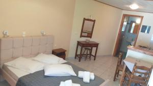 Postel nebo postele na pokoji v ubytování Aggelika Apartments