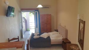 Postel nebo postele na pokoji v ubytování Aggelika Apartments