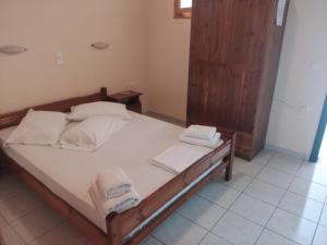 Postel nebo postele na pokoji v ubytování Aggelika Apartments
