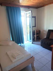 Postel nebo postele na pokoji v ubytování Aggelika Apartments