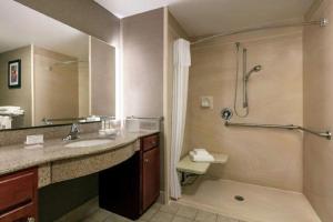 a bathroom with a sink and a shower at Sheraton Hotel Denver Tech Center in Greenwood Village