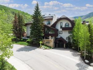 a house in the mountains with a driveway at Tyrolean 1 Vail Village in Vail