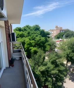 a balcony with a view of trees at Depto "Phima" zona residencial in Rosario