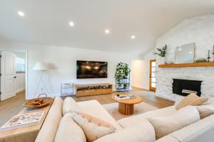 a living room with a couch and a fireplace at Naples Duplex Home with Private Pool and Lanai! in Naples
